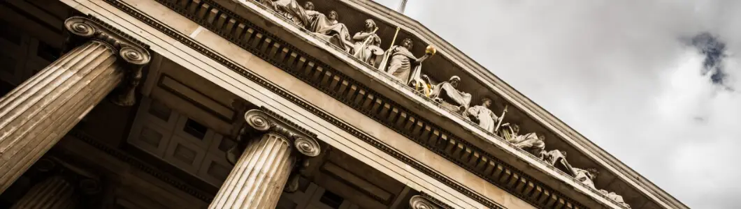 Image of the top of a courthouse with pillars. | Keystone Law