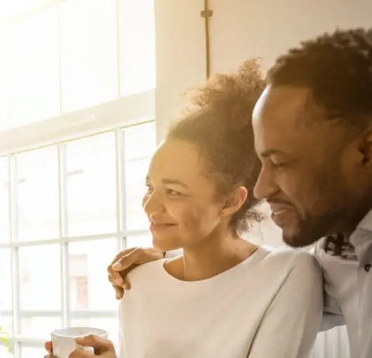 Image of a couple embracing and smiling. | Keystone Law