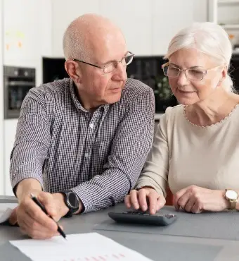 Image of an elderly couple discussing spousal debt obligations. | Keystone Law