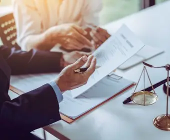 Image of person explaining legal paperwork. | Keystone Law