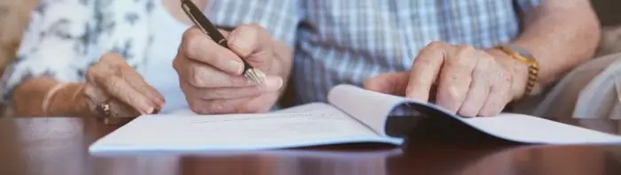 Image of person writing on paper. | Keystone Law