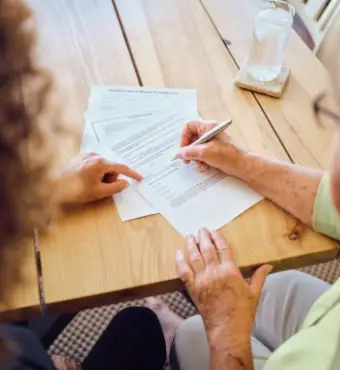 Image of person filling out legal documents. | Keystone Law
