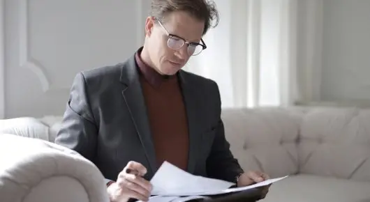 Image of person looking through paperwork. | Keystone Law