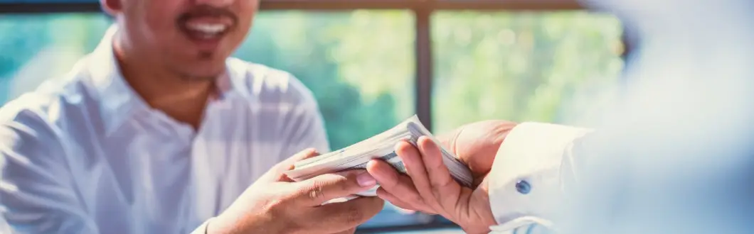 Image of a person receiving cash. | Keystone Law