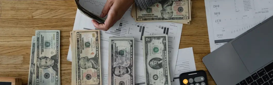 Image of cash sorted on a table. | Keystone Law