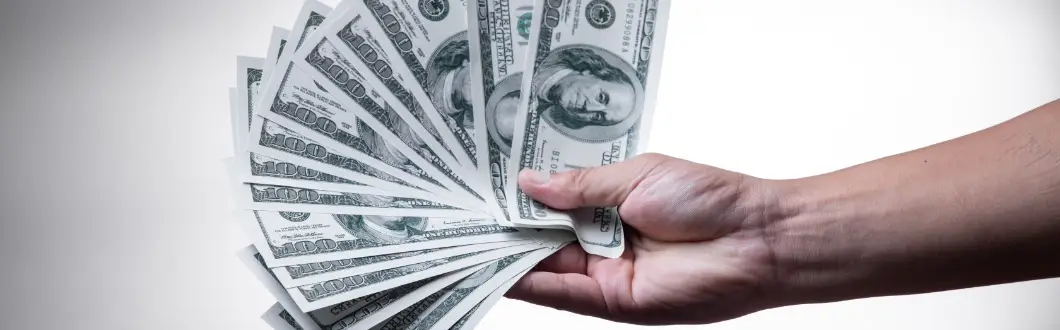 Image of person holding cash. | Keystone Law