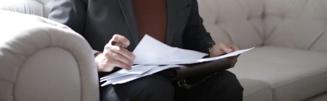 Image of person looking through paperwork. | Keystone Law