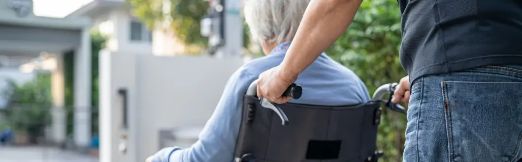 Image of person pushing elderly woman in wheelchair. | Keystone Law