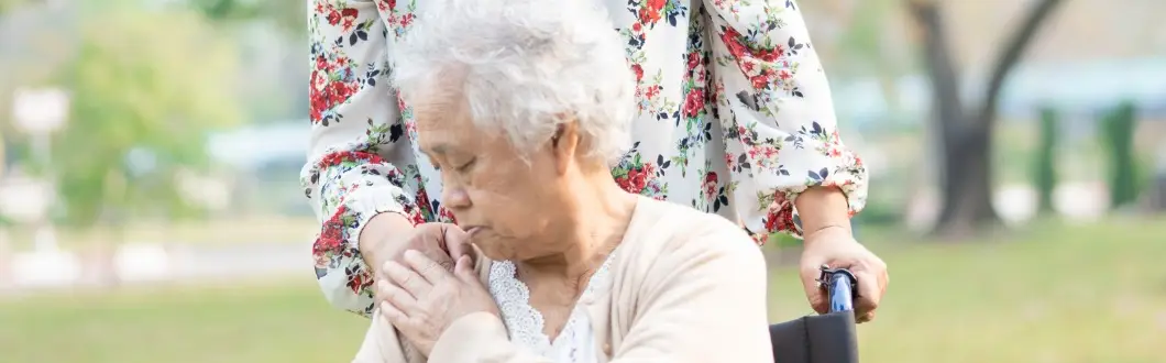 Image of person embracing elderly woman in wheelchair. | Keystone Law
