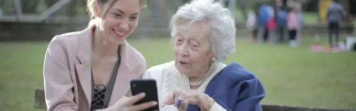 two people looking at a smartphone