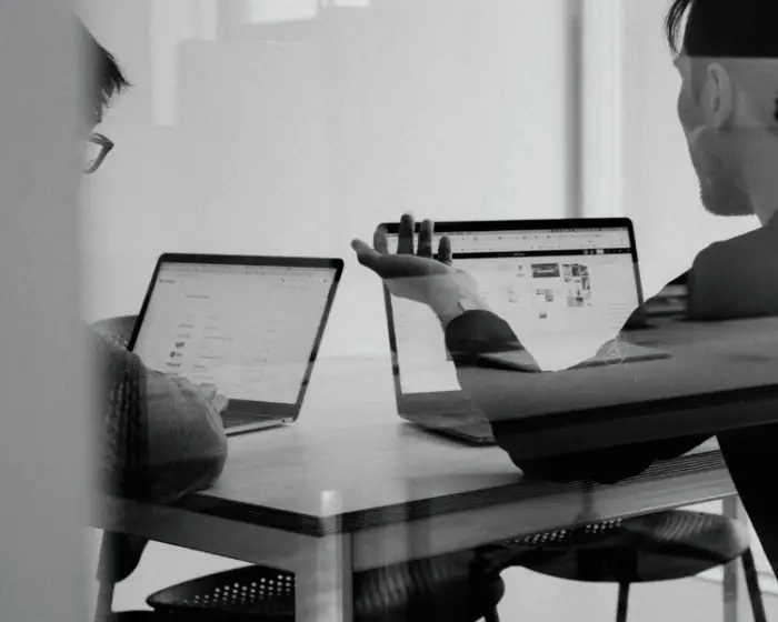 Image of an executor discussing duties with an attorney in front of two laptops. | Keystone Law