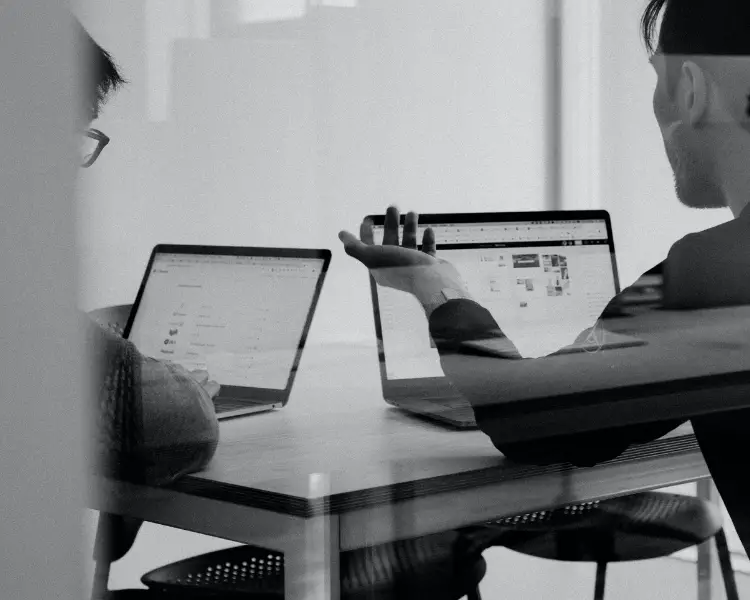 Image of an executor discussing duties with an attorney in front of two laptops. | Keystone Law