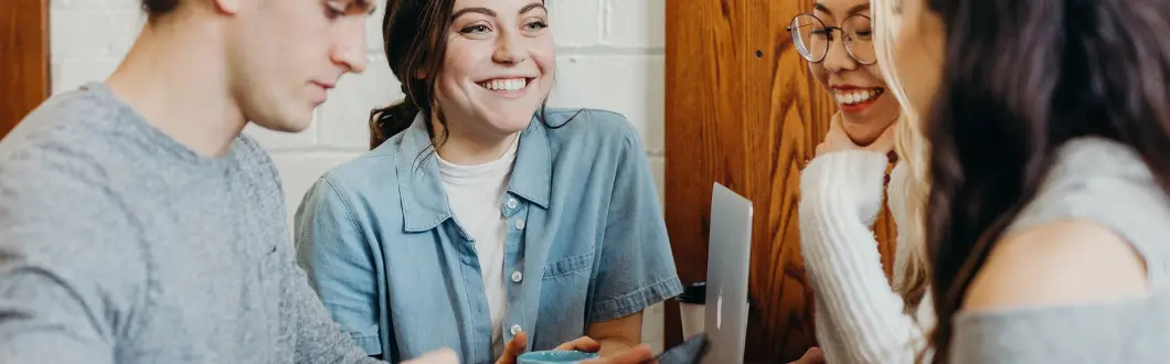 Image of people smiling around table. | Keystone Law
