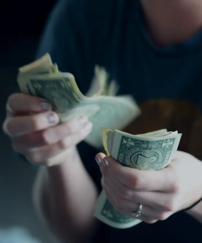 Image illustrating person counting cash. | Keystone Law