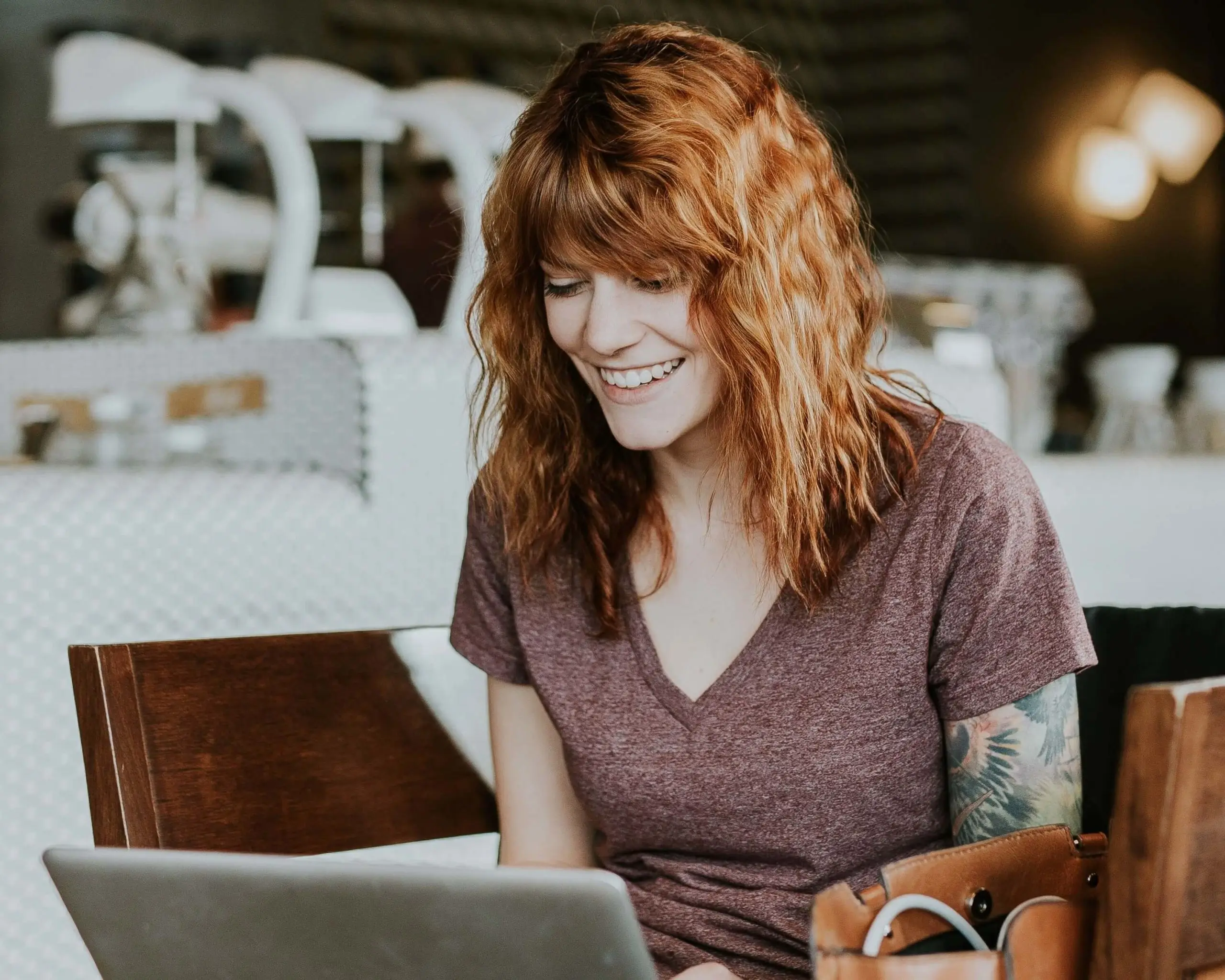 Image of woman smiling using laptop. | Keystone Law