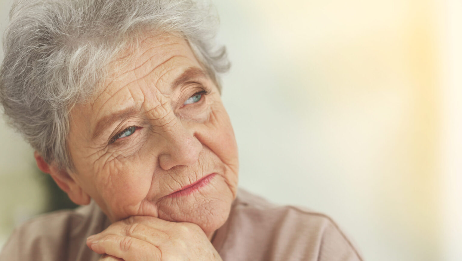 Depressed elderly woman at home