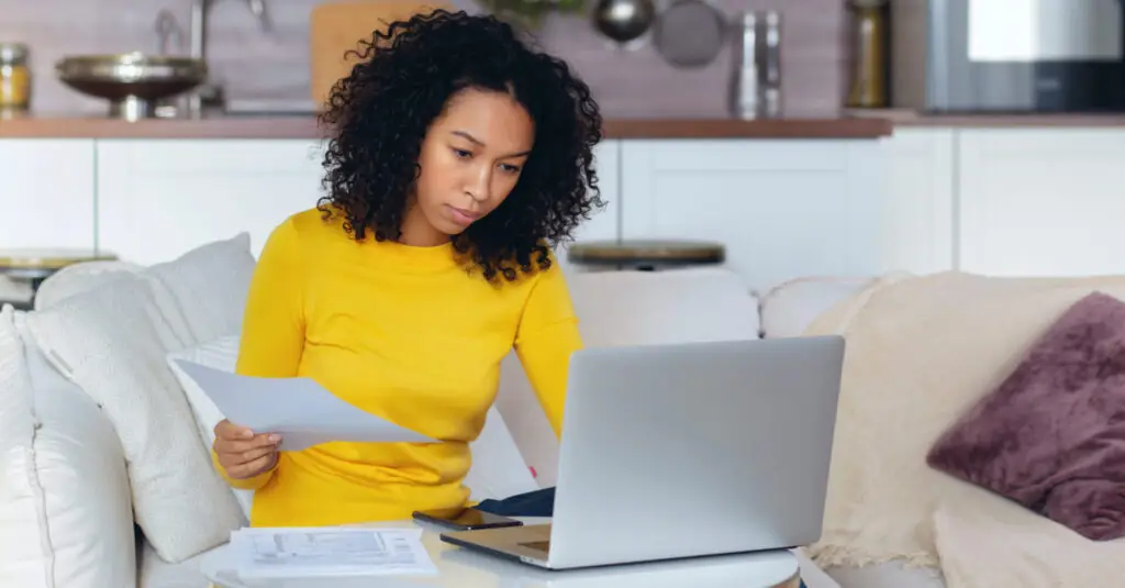 woman looking at bank statements