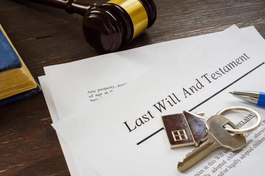 Last will and testament papers and key as symbol of property
