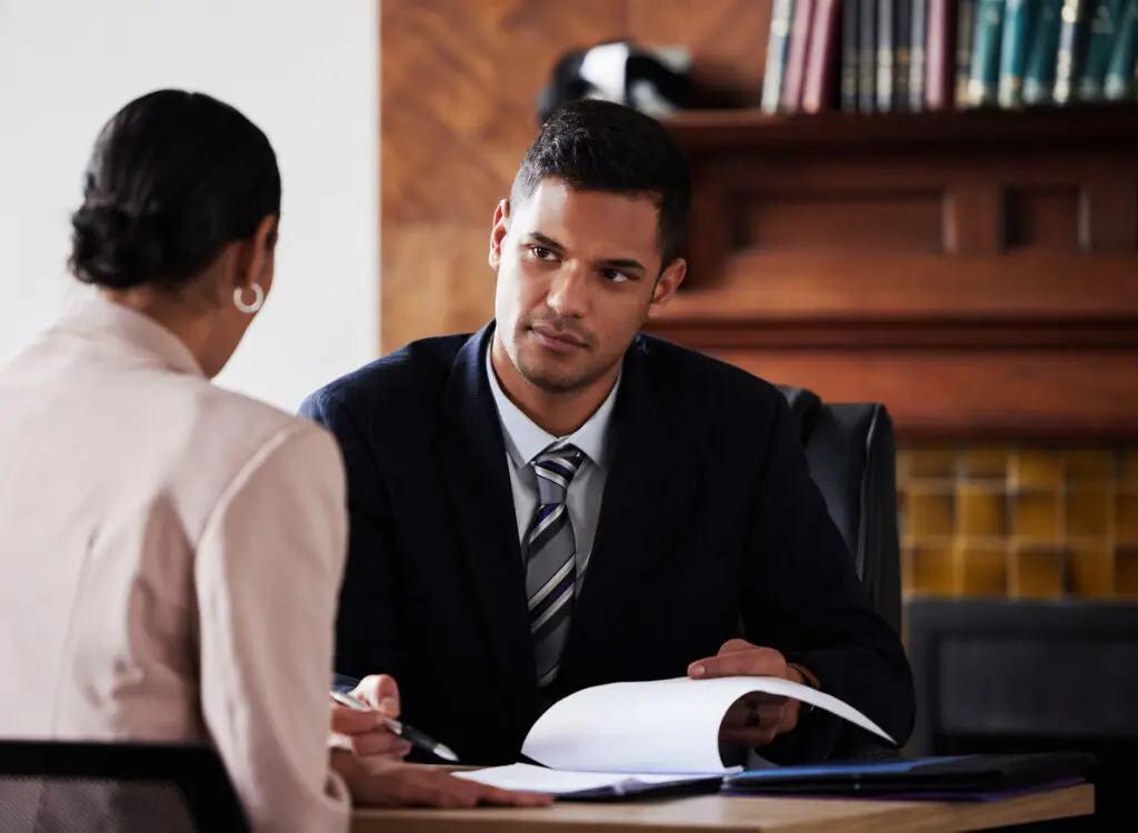 Contract, signature and attorney consulting a client in his office with legal paperwork or agreement