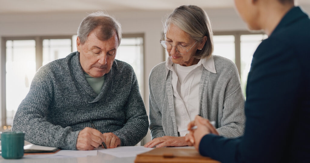 Signature, paperwork and senior couple with financial advisor for retirement annuity saving account. Discussion, finance documents and elderly man and woman with investment banker for pension growth