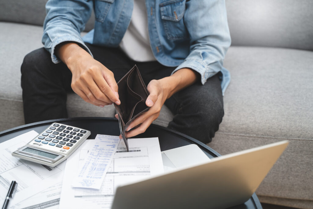 Bankruptcy problem financial concept, Young man opening empty wallet stress to find money to pay debt mortgage  period