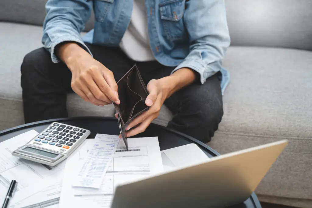 Bankruptcy problem financial concept, Young man opening empty wallet stress to find money to pay debt mortgage  period